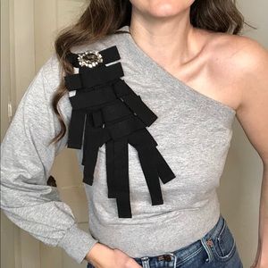 VICOLO one shoulder embellished sweater with built in brooch